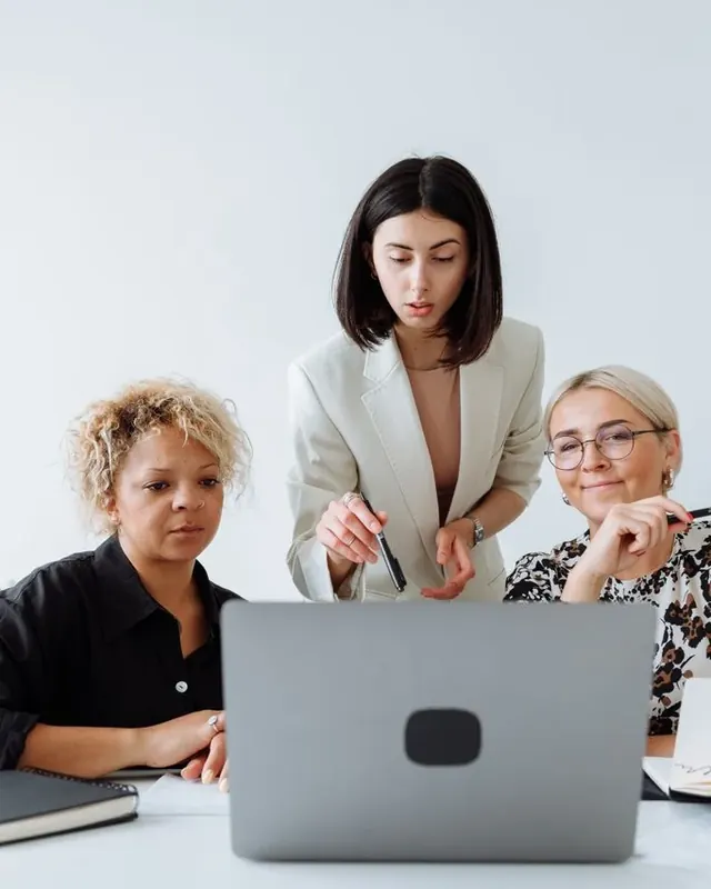 A team reviewing a page together before approving it