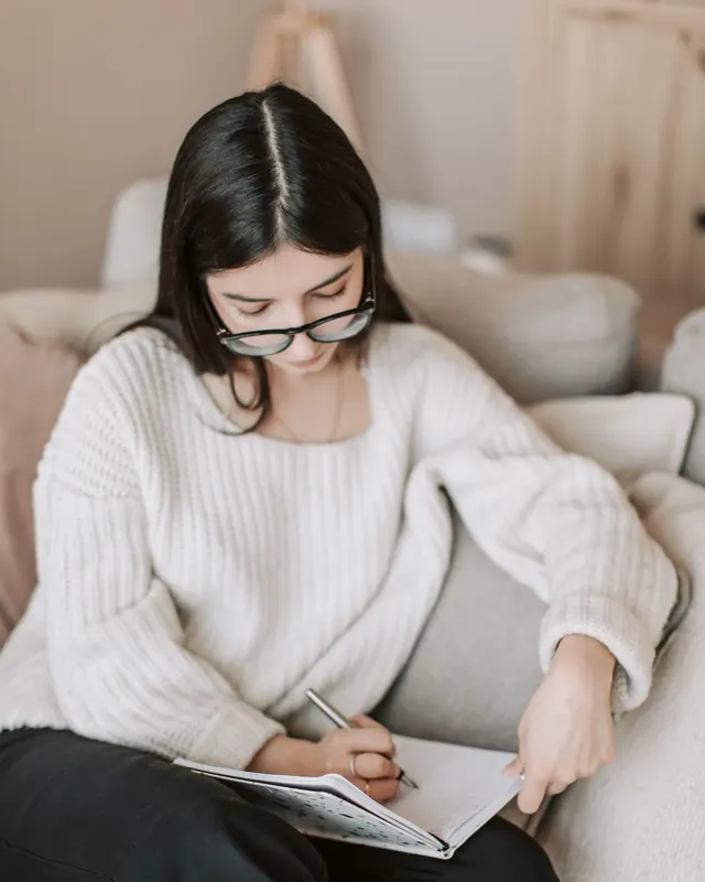 An editor reviewing a draft with a pen